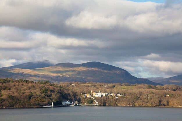 View across an estuary towards portmerion tourist village in north wales