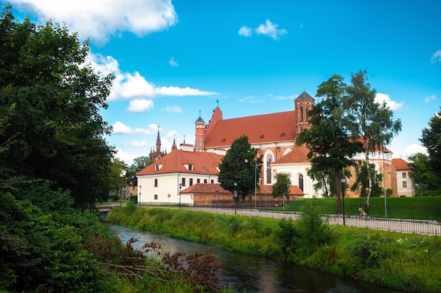 View across the river To The Roman Catholic Church Of St. Anne And The Church Of St. Francis And St. Bernard In LITHUANIA, VILNIUS,