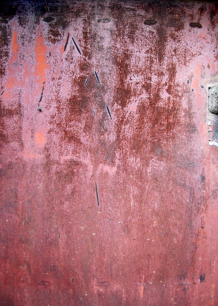 view on aged metal surface of the wall of the old house