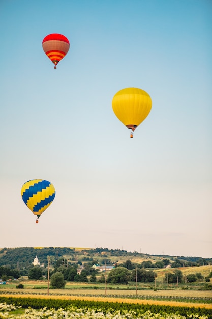 View of air balloon with basket flies on sunset copy space