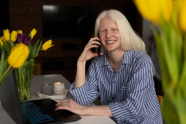 View of albino woman at home during the day