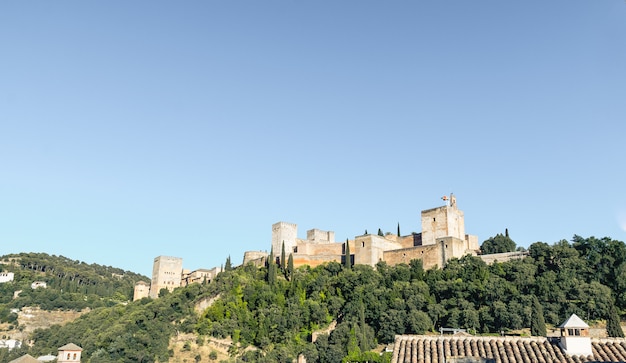 View of the Alhambra Palace from the Carvajales viewpoint. Blue sky for copy space or collage