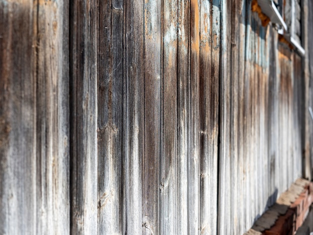 Photo view along the old wooden wall. selective focus