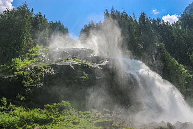 View Alpine inspiring Krimml waterfall in mountains in summer day. Trekking in National park Hohe Tauern, Austria