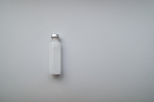 View of ampoule with white background and copy space