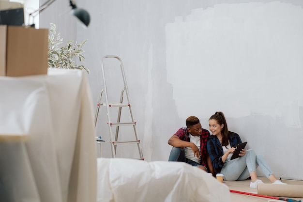 View of an apartment in its raw state during renovation painting walls