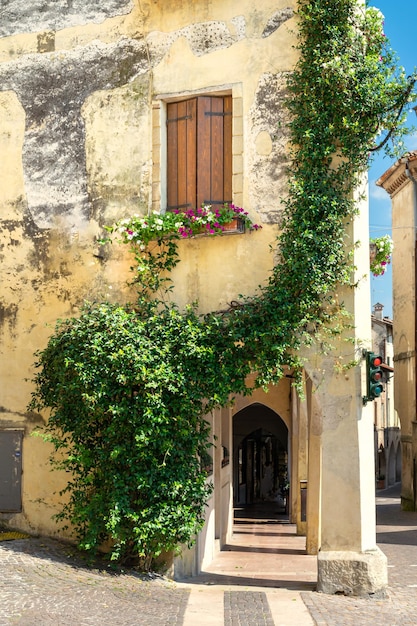 View of the arcades of the ancient village of Asolo in summer Treviso Italy