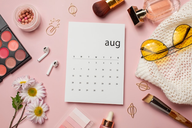 Above view august calendar and make up