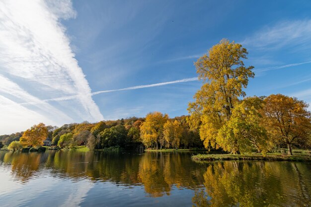 View of the autumn colours around the lake at stourhead gardens in wiltshire