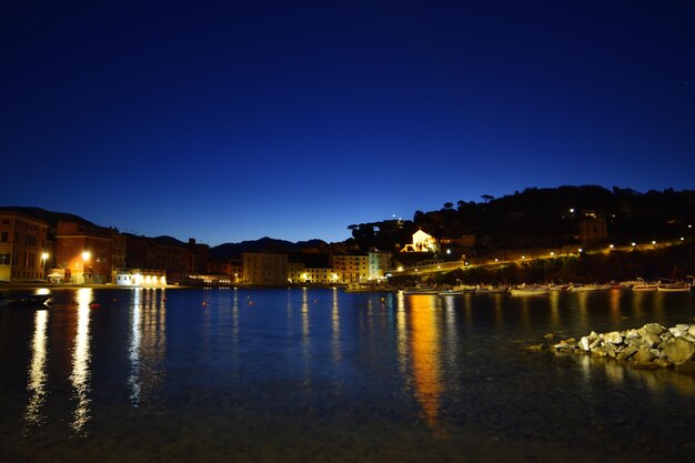 View of the Baia del Silenzio beach at night with spectacular lights and reflections