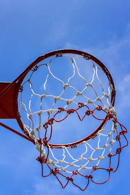 A view of a basketball hoop from below