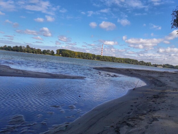 View of beach against cloudy sky