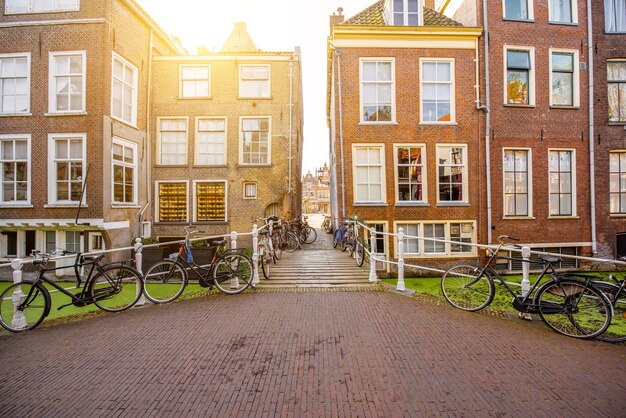 View on the beautiful old buildings and water channel in Delft town during the morning light, Netherlands