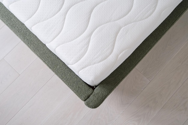 above view of bed corner with mattress closeup