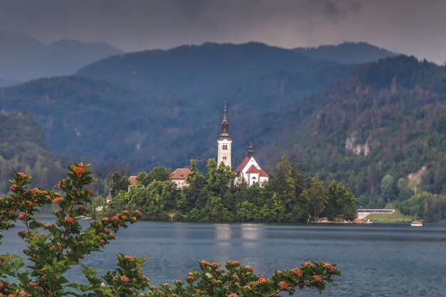 view of bled lake bled island with small pilgrimage church mountains in background slovenia