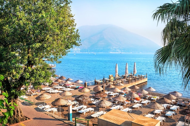 View of the blue sea pier and greenery of the hotel Marmaris Turkey