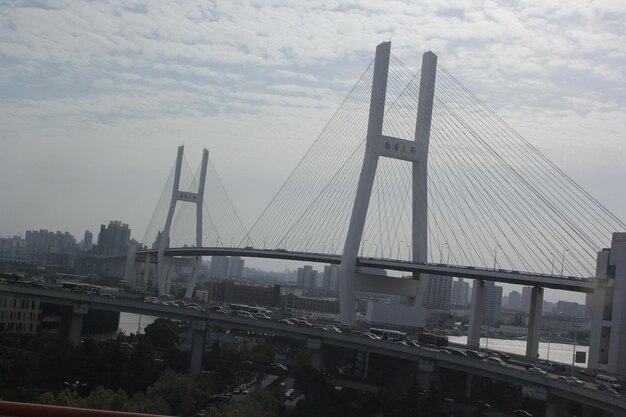 View of bridge against cloudy sky