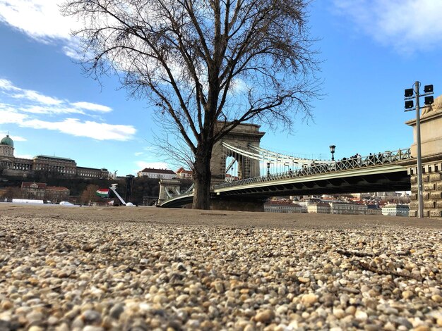 View of bridge and buildings against sky