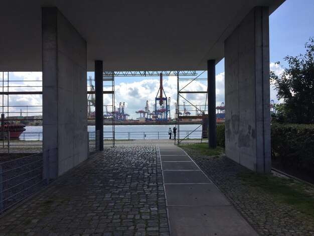 View of bridge in city against sky