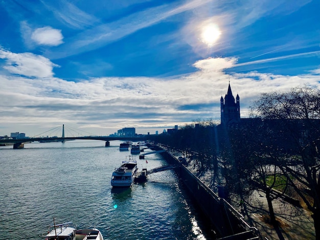 View of bridge over river against cloudy sky