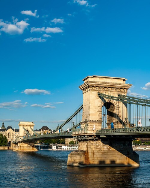 View of bridge over river against cloudy sky