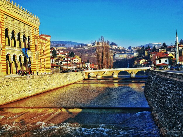 View of bridge over river in city