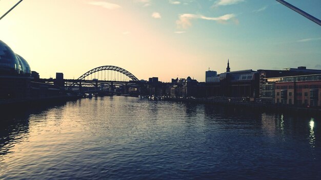 View of bridge over river in city