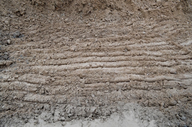 View of brown cracked natural moist earth clay The background Texture