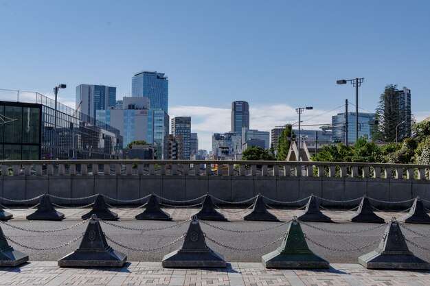 View of buildings in city against blue sky