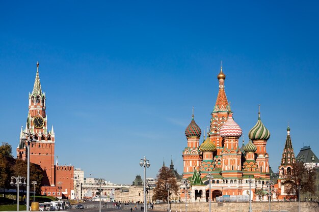 View of buildings in city against blue sky