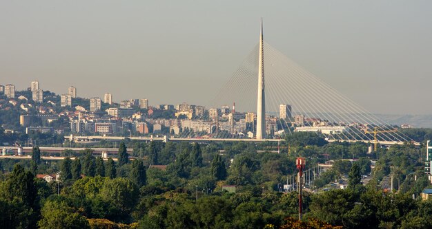 View of buildings in city against clear sky