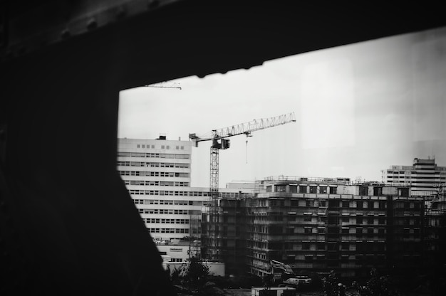 View of buildings and crane  in city