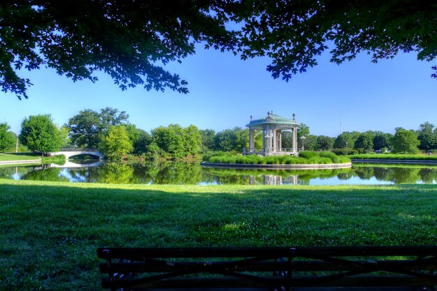 Photo view of built structure with trees in foreground