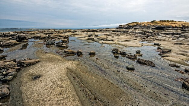 Photo view of calm beach against the sky