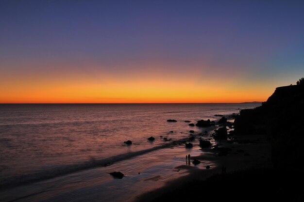 View of calm sea at dusk