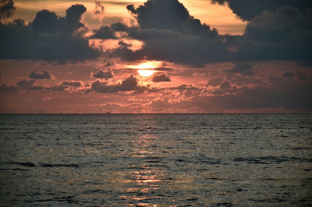 view of calm sea at sunset