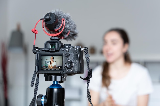 View of the camera recording a woman creating content for social media