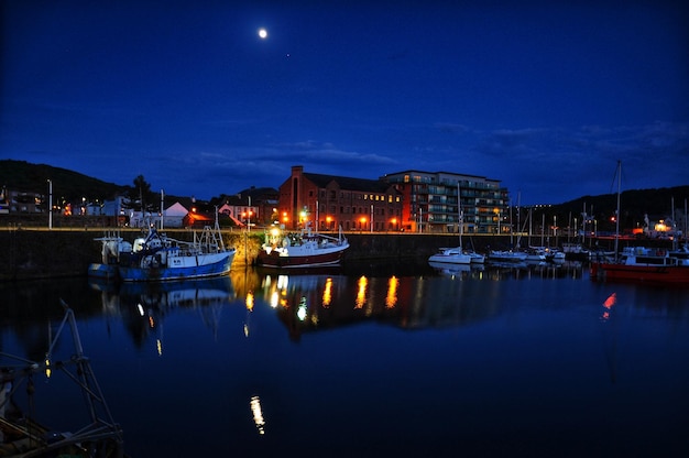 View of canal in city at night