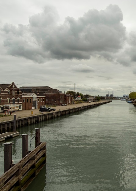 View of the canal with boats and beautiful buildings of Vlaardingen Rotterdam Netherlands Holland