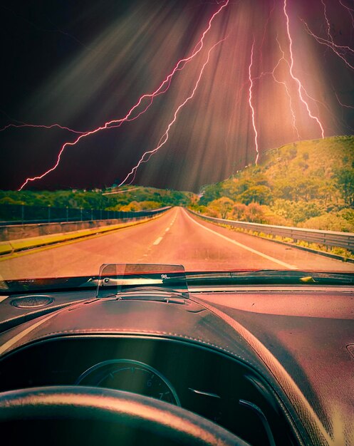 View of car moving on road at night