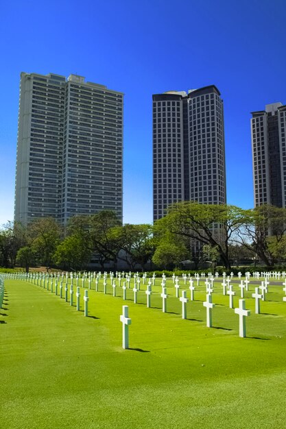 View of cemetery against buildings in city