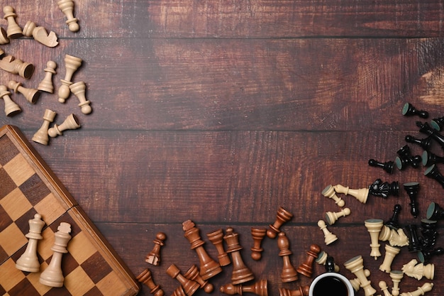 Above view chess board with chess pieces on wooden background competition and strategy