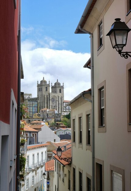 A view of a city from a narrow alley.