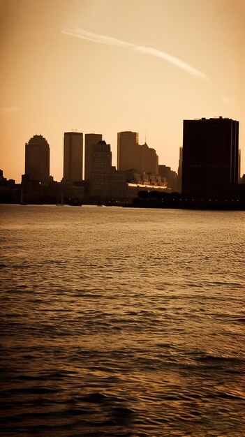 A view of the city from the water with the city skyline in the background.