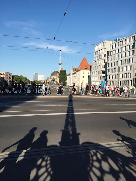 View of city street against blue sky