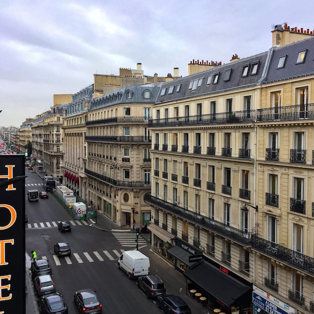 View of city street and buildings against sky