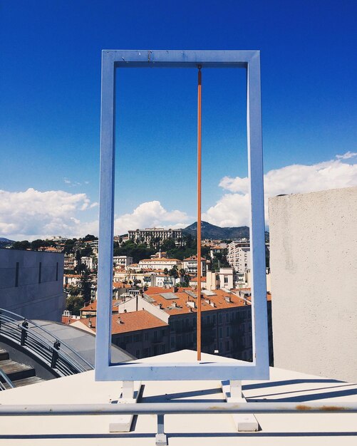 View of cityscape against blue sky