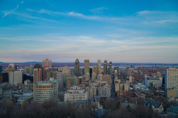 View of cityscape against cloudy sky