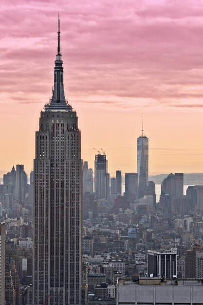 View of cityscape against cloudy sky