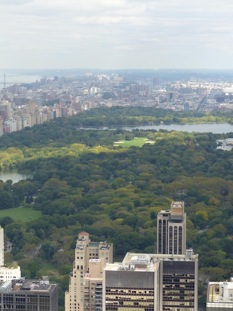 View of cityscape against cloudy sky